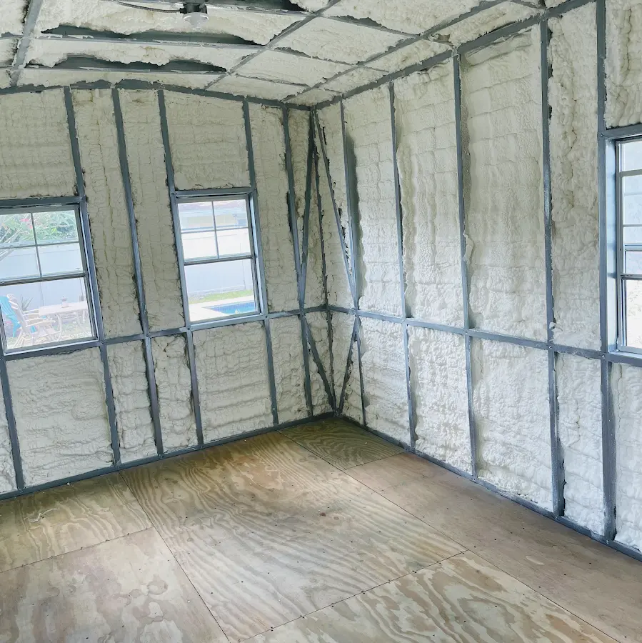 Closed-cell spray foam insulation applied to wall cavities in a residential project in Elizabeth City